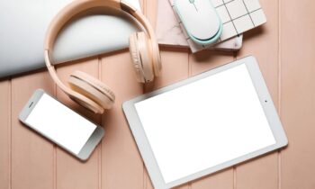 A home office desk with a laptop and headphones.