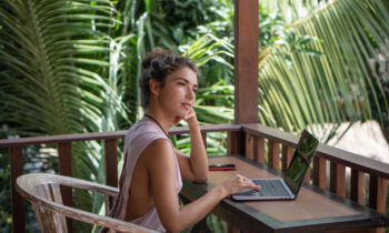 A female digital nomad working in a exotic location