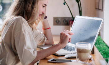 A female job seeker looking online for 12 Meaningful Work at Home Jobs Helping People