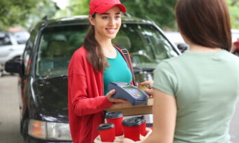 A woman delivering food with DoorDash