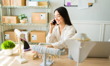 A woman selling jewelry from home for blog post best products to sell from home