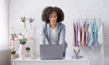 A woman working on her laptop looking for the best sites to sell stuff online