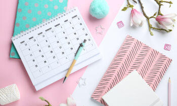 A desk space with a calendar for find your business idea in a weekend