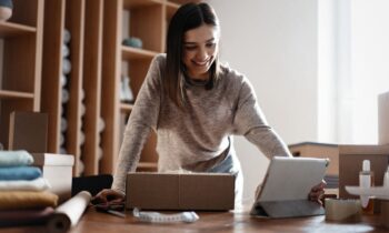 An eBay reseller, working from her home office, organizing and shipping products.
