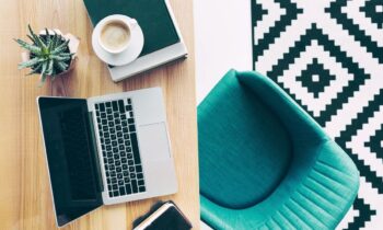 Overhead view of a Williams-Sonoma remote worker's home office, with stylish furniture and a laptop.