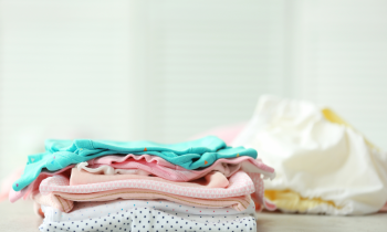 pile of baby clothes to be sold on thredUP