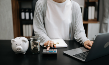 Woman calculating her earnings and looking for work from home jobs that pay weekly