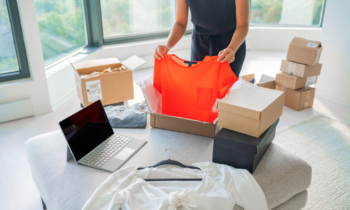 Woman using online consignment shops to sell clothing