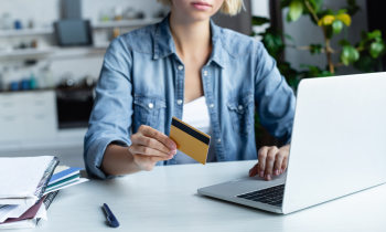 Young woman reading how to earn free Amazon gift cards online